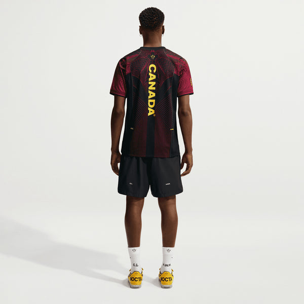 NOCTA x Canada Short Sleeve Top in Black/University Red/Sonic Yellow