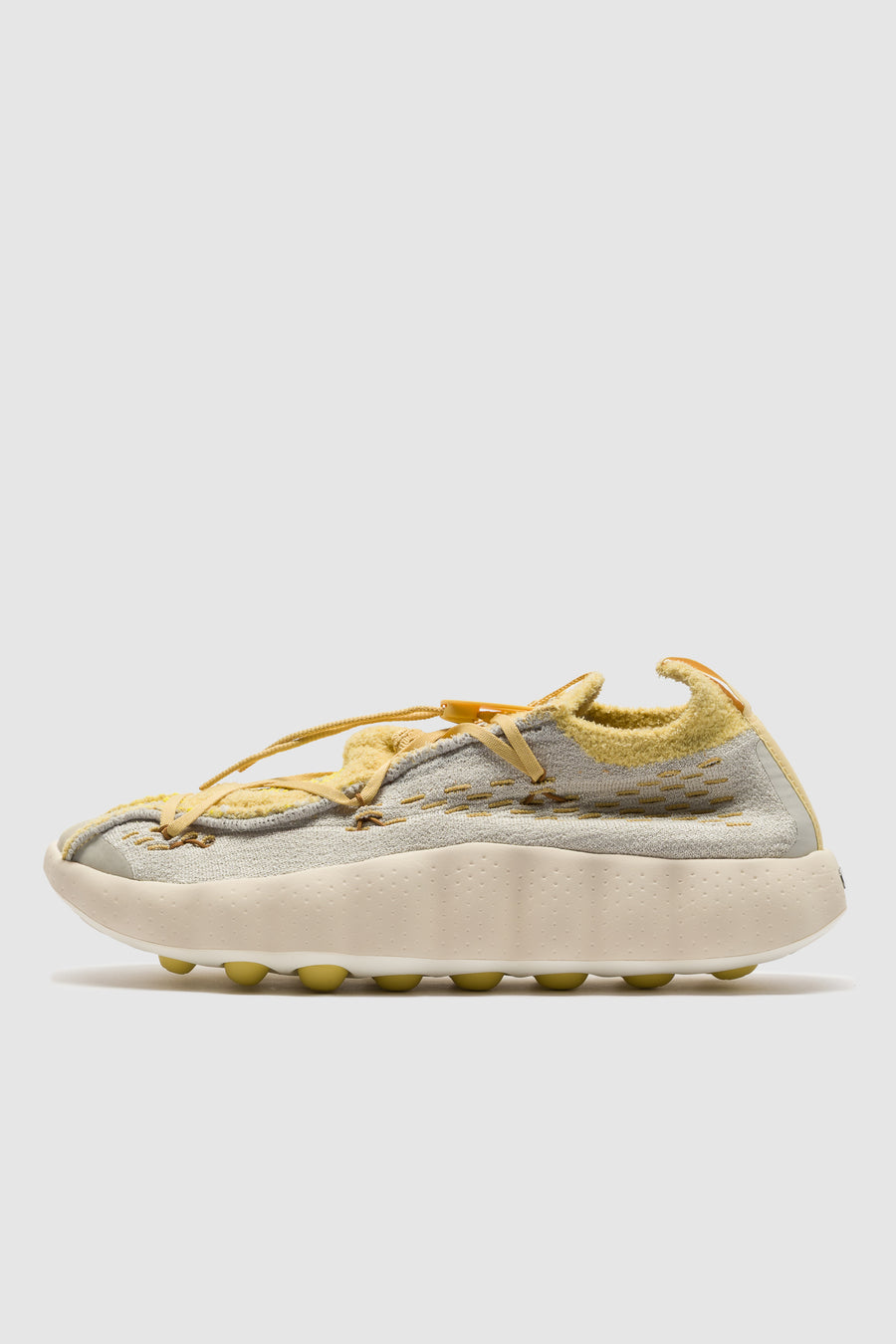 Mind 002 Flyknit Sneaker in Light Bone/Saturn Gold/Infinite Gold