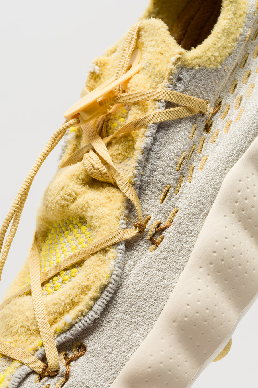 Mind 002 Flyknit Sneaker in Light Bone/Saturn Gold/Infinite Gold