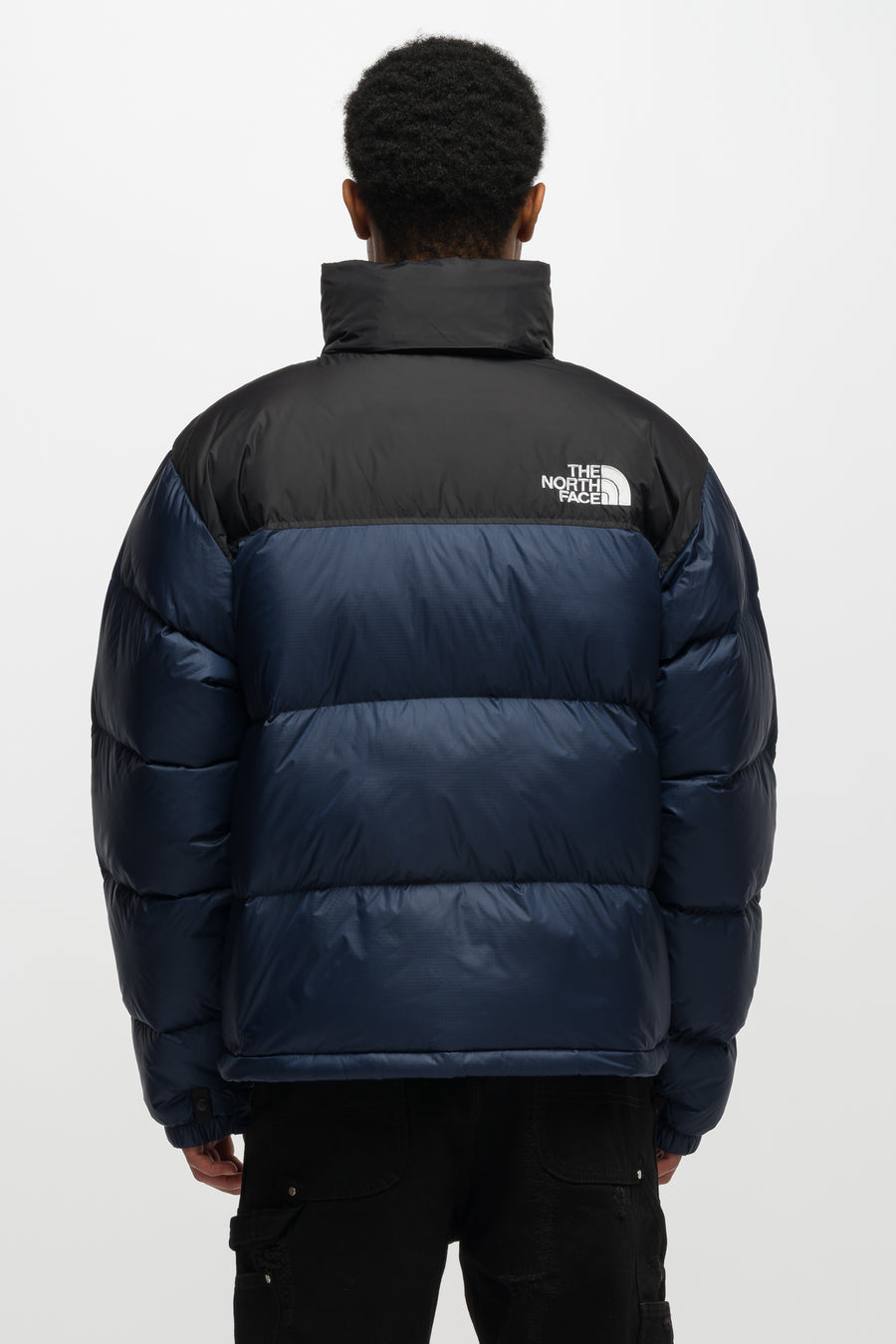 The North Face 1996 Retro Nuptse Jacket in Summit Navy/TNF Black - Notre