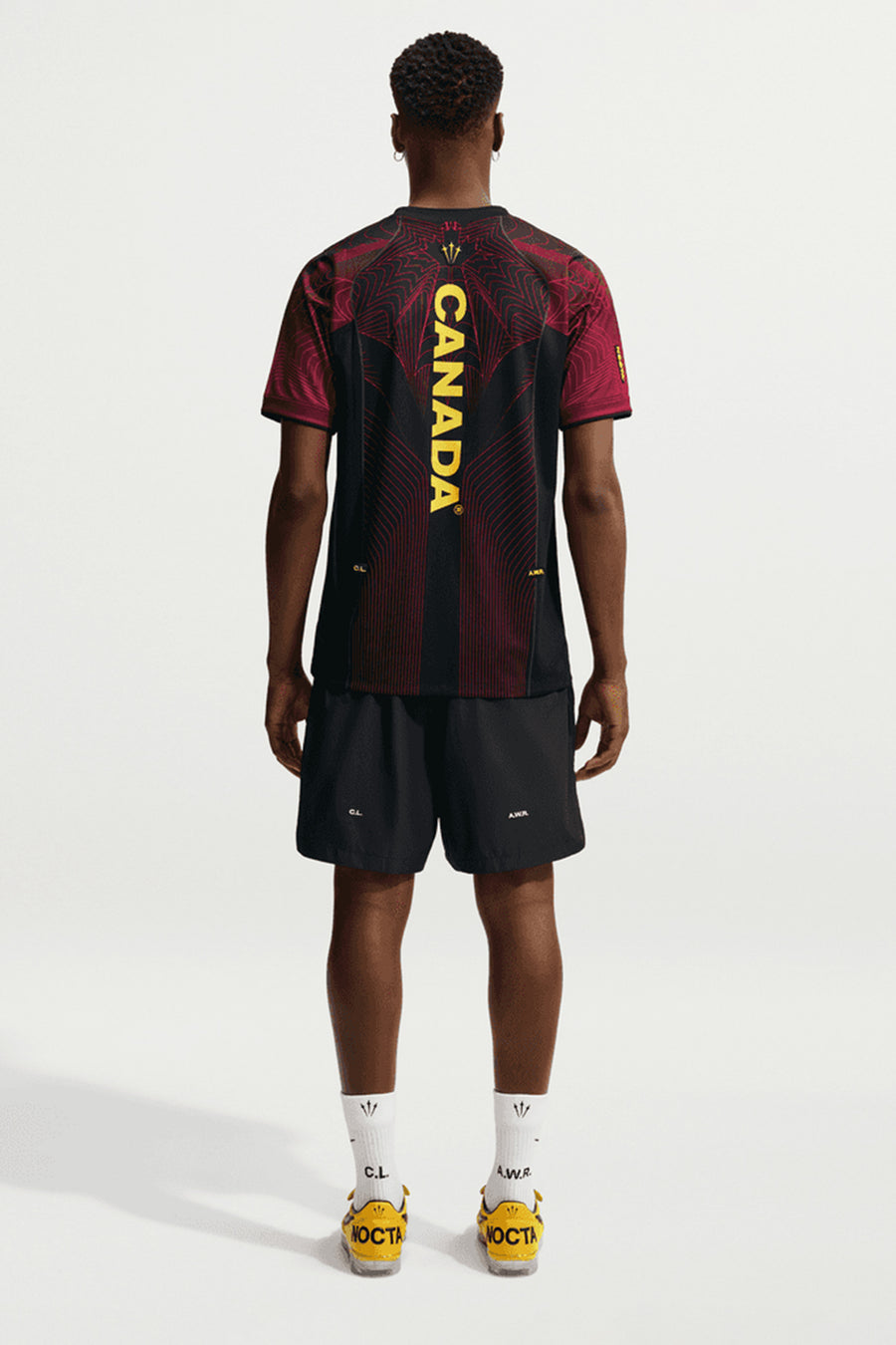 NOCTA x Canada Short Sleeve Top in Black/University Red/Sonic Yellow