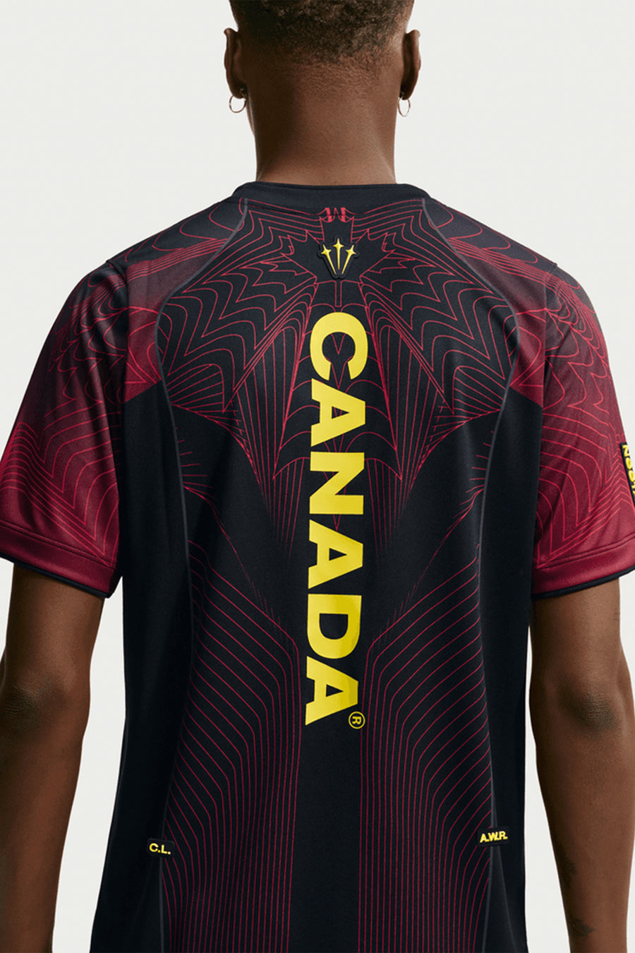 NOCTA x Canada Short Sleeve Top in Black/University Red/Sonic Yellow